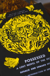 A close-up of a book cover for 'Possessed: A Lost Novel of the Oakham Forest' by Rosalie and Edward Styron, featuring a bold yellow graphic illustration on a black background.